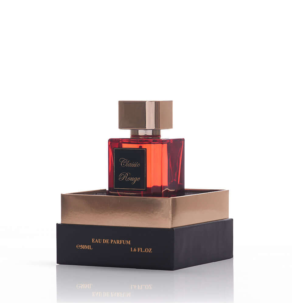 Classic Rouge fragrance bottle with elegant packaging, featuring floral and woody notes for day and evening wear.