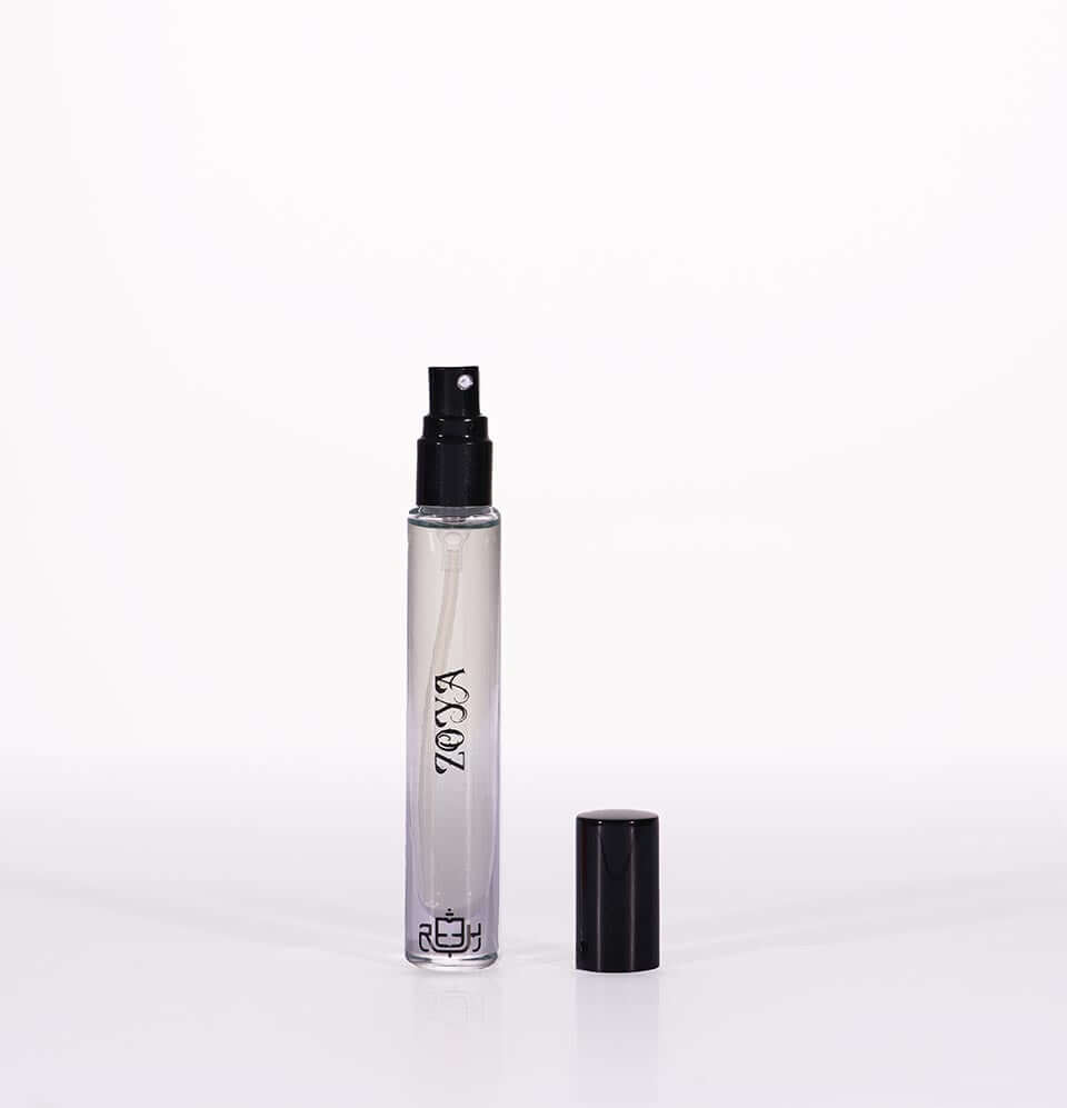 Miniature fragrance gift set for women with a clear spray bottle and black cap from REEH AL MADINAH.