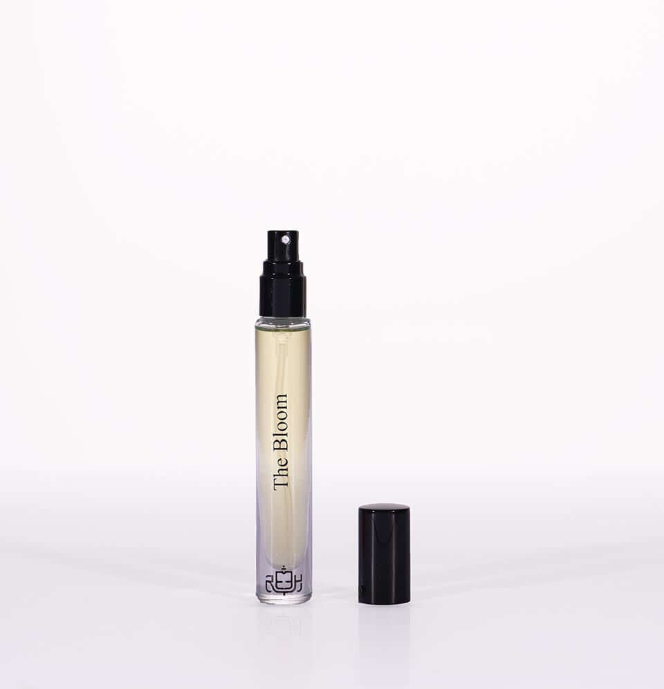 Miniature fragrance gift set for women featuring The Bloom perfume in a stylish spray bottle.